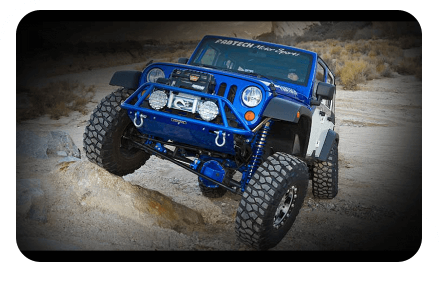 Blue jeep on hilly road